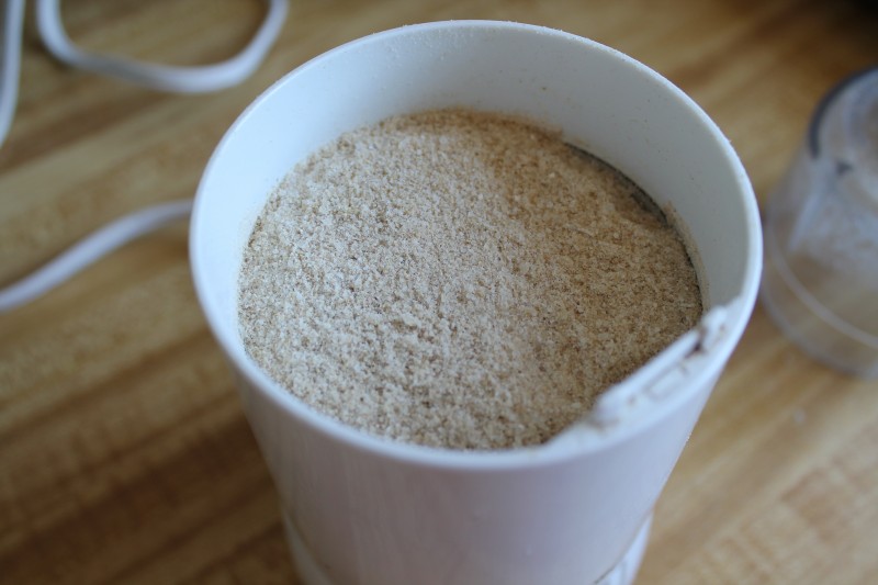 A photo of sprouted brown rice flour in a grain mill
