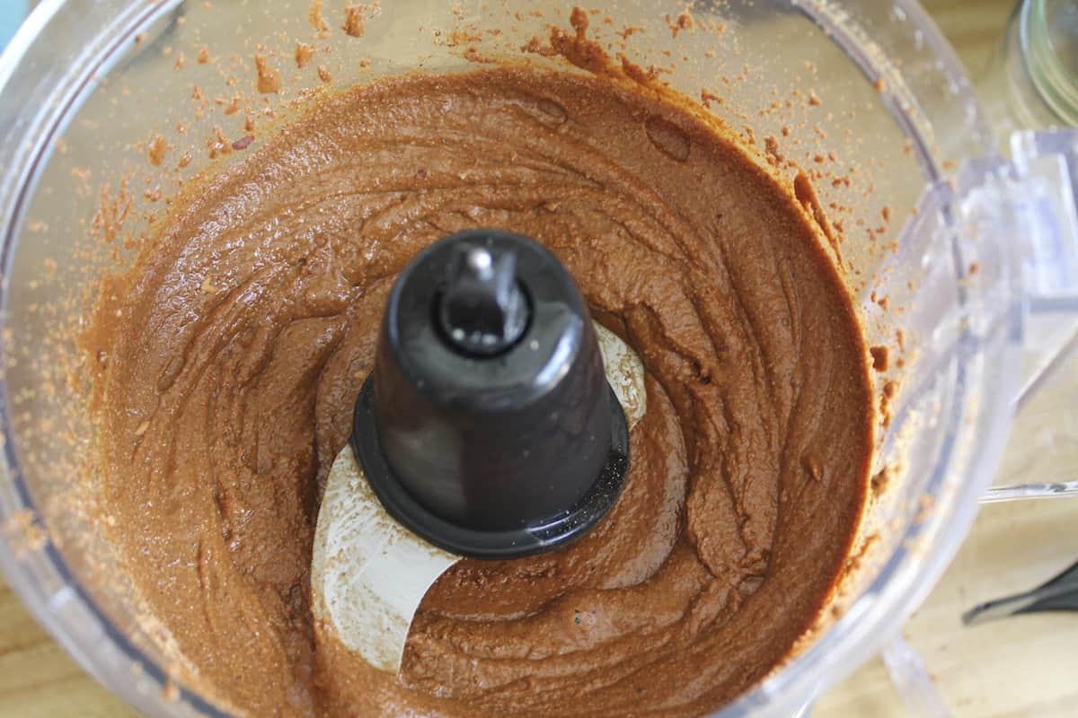 overhead shot of food processor with almond butter in it
