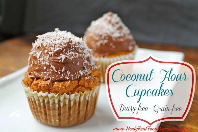 Two coconut flour cupcakes topped with chocolate frosting and shredded coconut