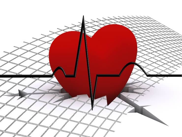 Illustration of a red heart cracking the white surface with a heart monitor line through it