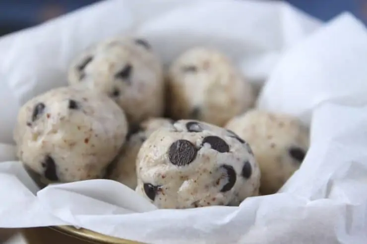 Close up of keto cookie dough fat bombs in white paper