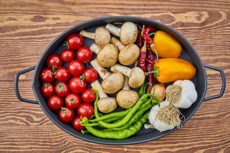 Tray of various vegetables on a wooden table