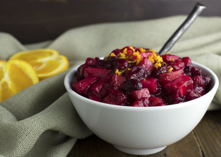 Cranberry sauce in a bowl topped with orange