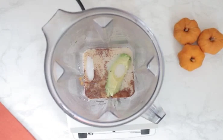 Overhead view of blender with unmixed ingredients in it