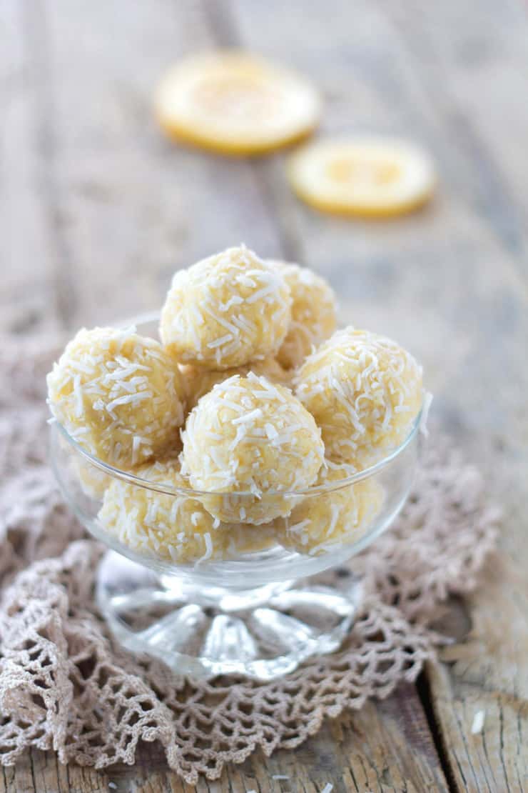A small glass bowl filled with lemon coconut truffles