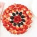 An overhead shot of a No Bake Fruit Tart made with red berries and a fork at the side