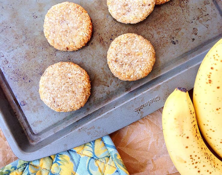 cookies on a baking sheet with bananas next to it