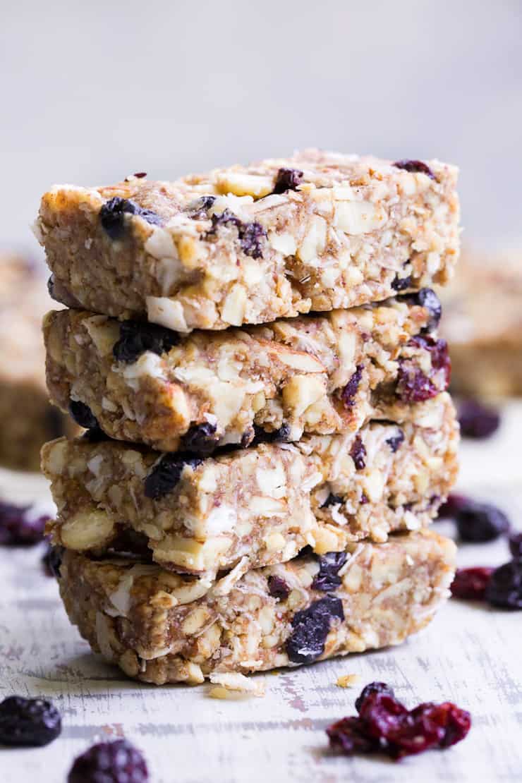 four stacked granola bars on white surface