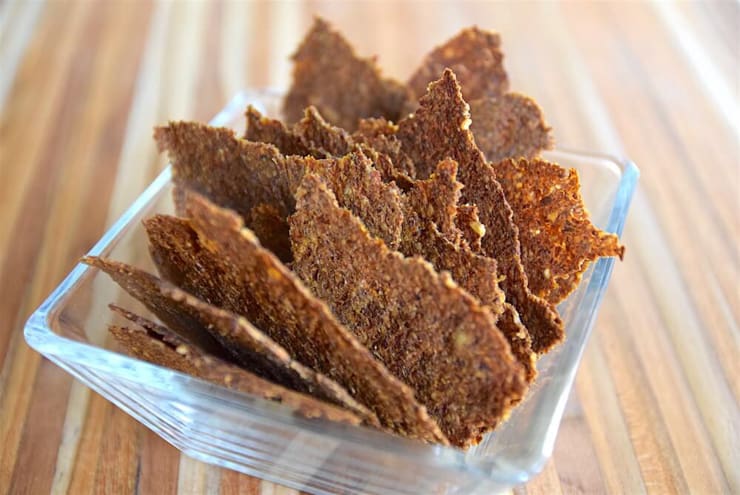 A stack of carrot pulp crackers in a glass bowl