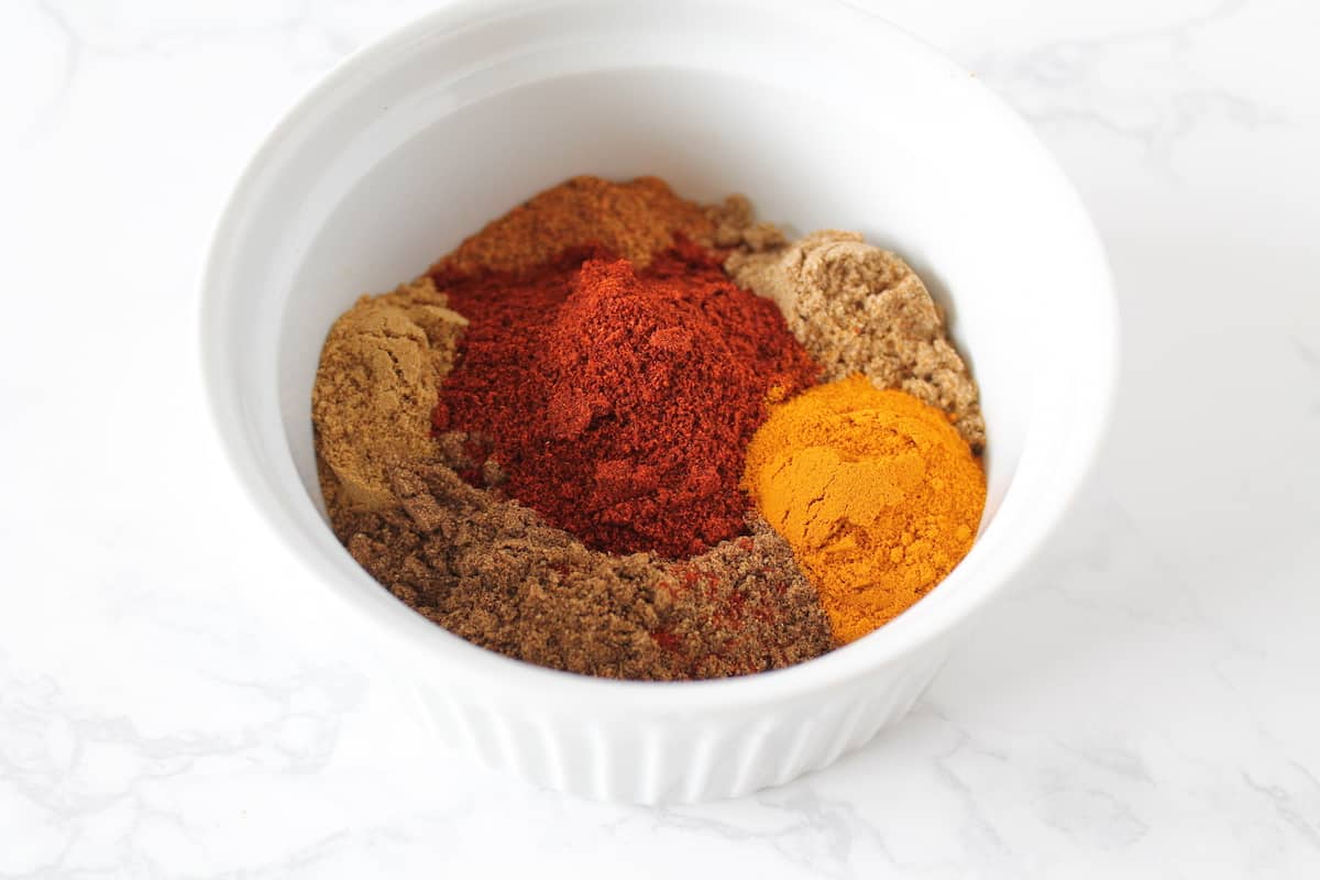 White bowl filled with colorful spices