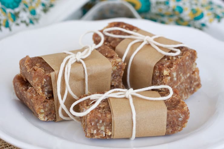 Small stacks of nut bars wrapped in brown paper and tied with string
