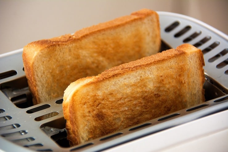 2 slices of toast in a toaster