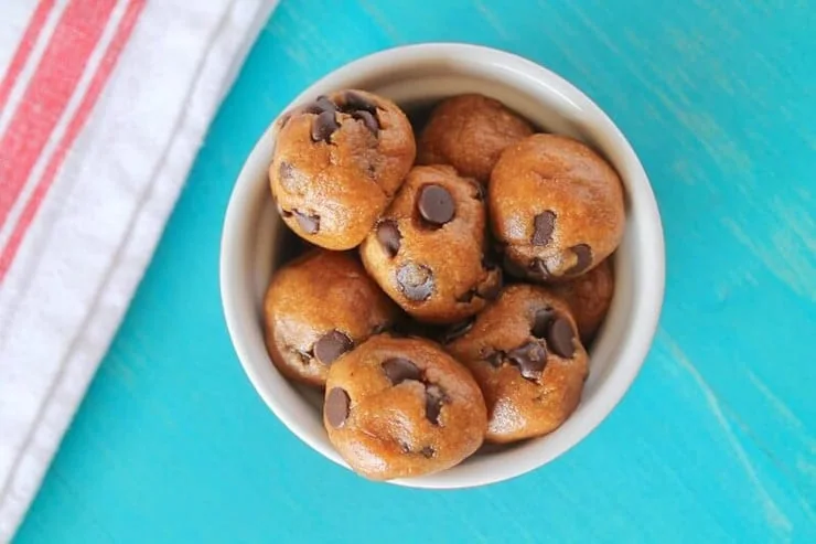 An overhead shot energy balls in a white ramekin