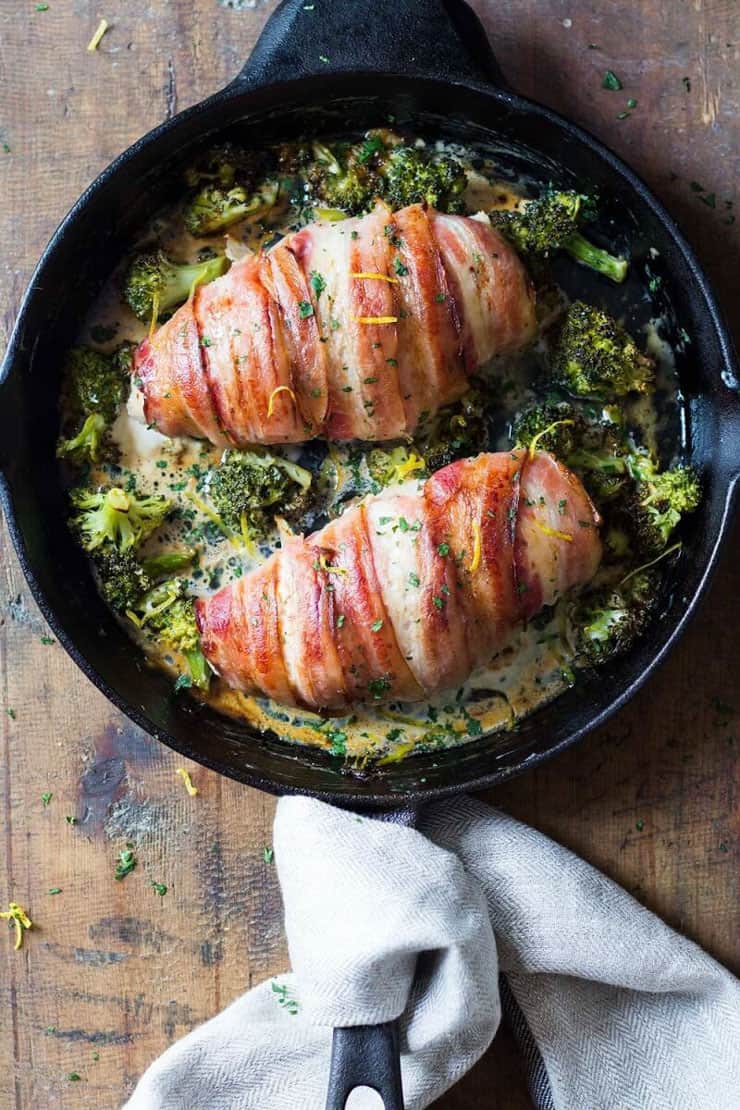 A keto recipe for chicken wrapped in bacon and served with broccoli