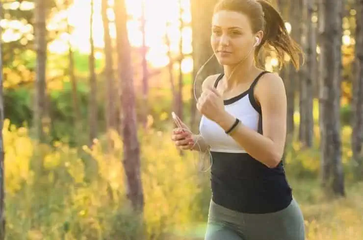 Woman running in the forest