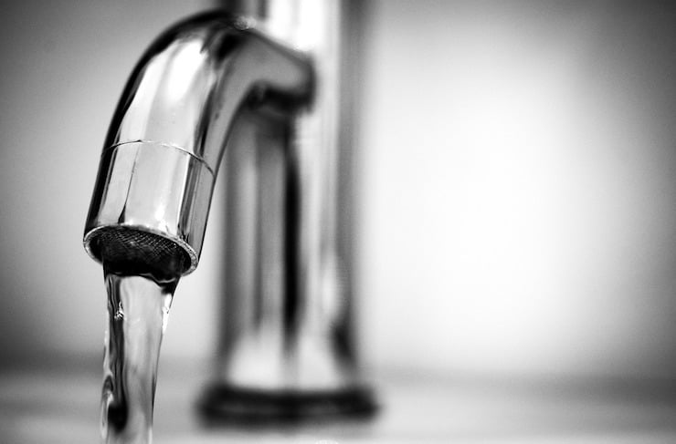 Stainless steel sink faucet with water coming out