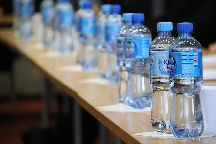 Plastic Water bottles on a table in a row