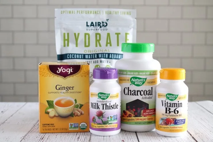 Collection of hangover home remedies on white wooden table