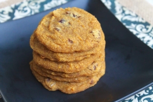 A close up of pumpkin cookies stacked on top of each other
