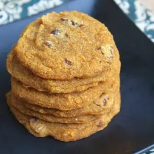 A close up of pumpkin cookies stacked on top of each other