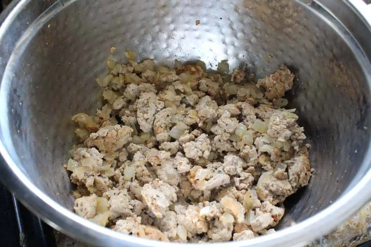 Cooked ground turkey in a mixing bowl