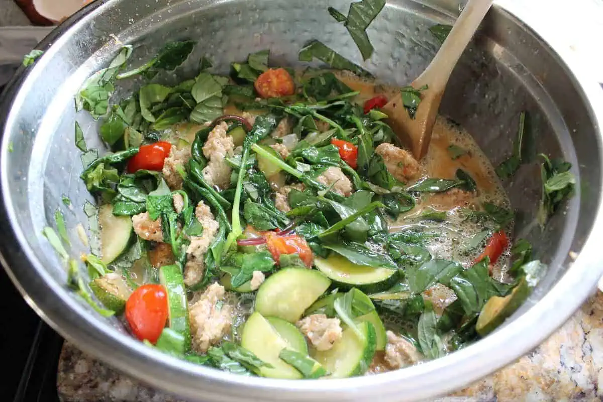 Uncooked frittata ingredients combined in a mixing bowl