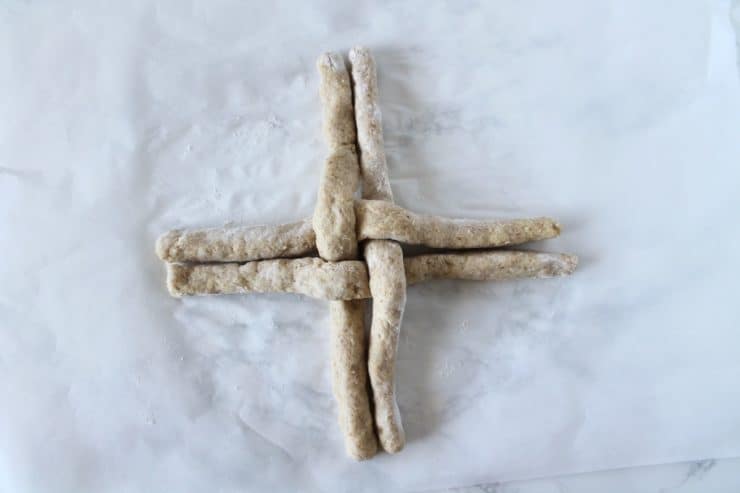 four long ropes of challah overlapped in a cross shape
