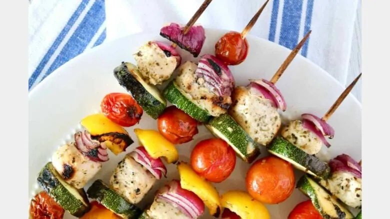 close up of kabobs with chicken and vegetables