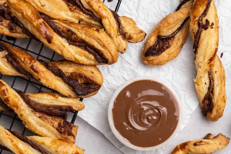 Nutella puff pastry twists on a cooling rack.