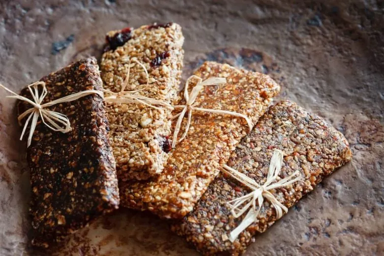 Four protein bars laid out on a table.