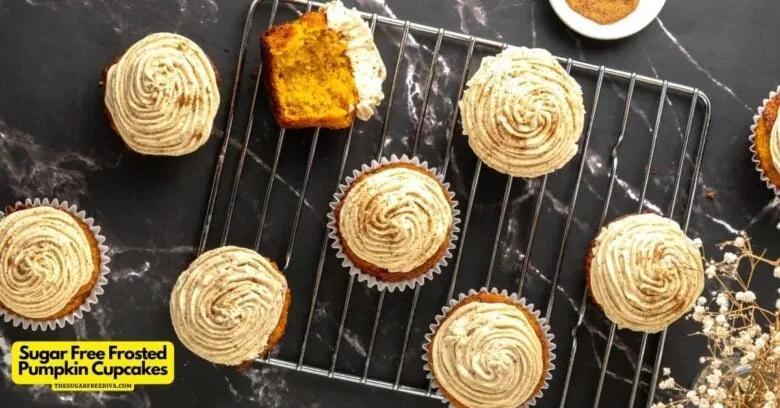 Some pumpkin cupcakes are sitting on a cooling rack.