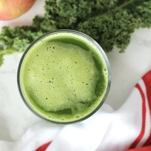A glass of first watch kale tonic green juice with apples and kale.
